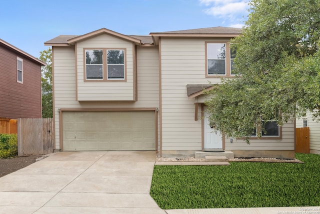 view of front of house featuring a front lawn and a garage