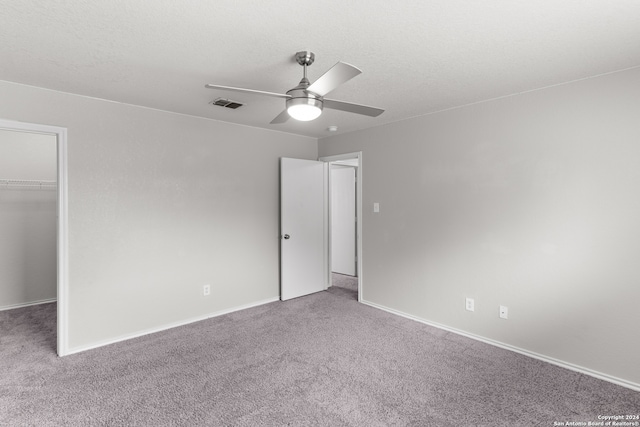 spare room with carpet flooring and ceiling fan