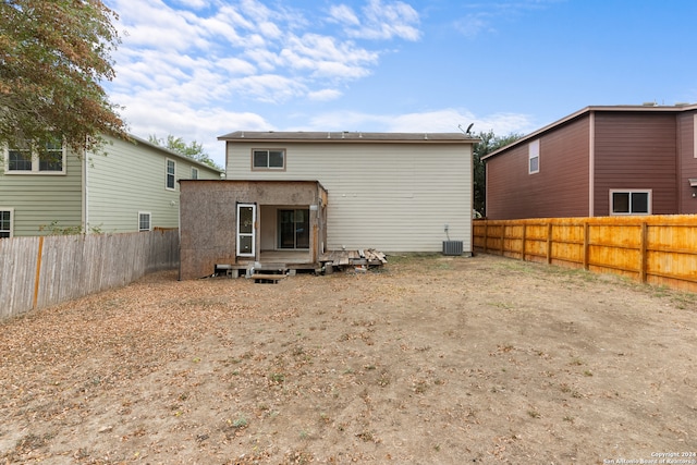 rear view of property with central air condition unit