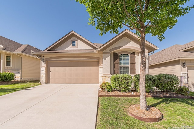 ranch-style house with a garage and a front lawn