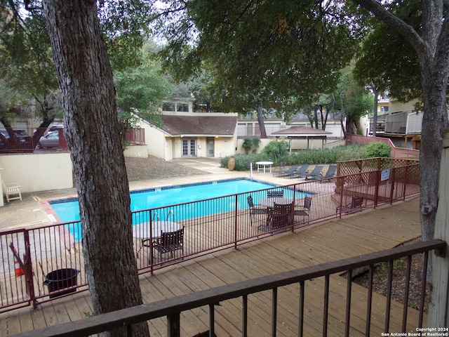 view of swimming pool with a patio