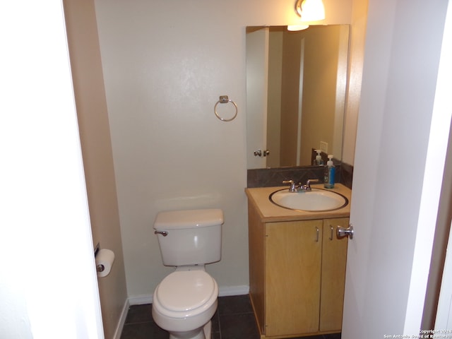 bathroom featuring vanity, toilet, and tile patterned floors