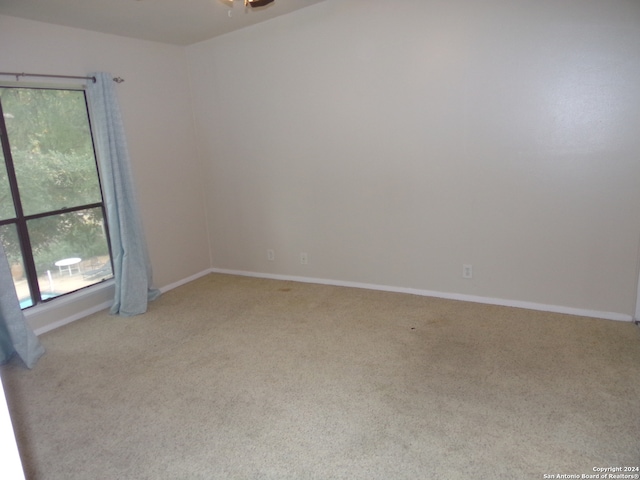 spare room with light carpet