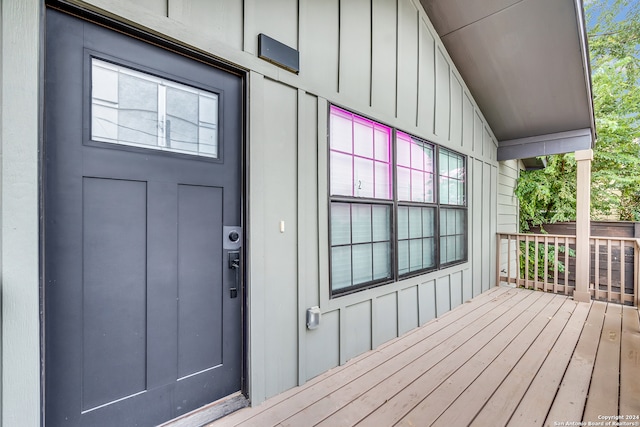 doorway to property featuring a wooden deck