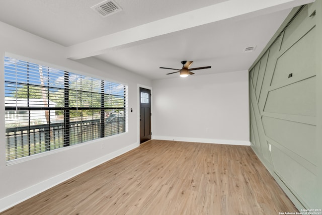 spare room featuring light hardwood / wood-style floors and ceiling fan