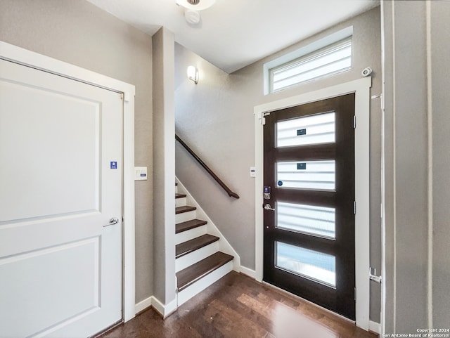 foyer entrance with dark hardwood / wood-style floors