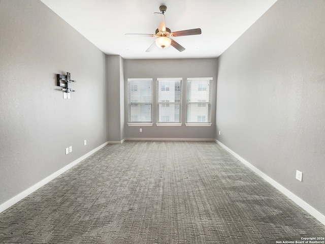 unfurnished room featuring carpet floors and ceiling fan