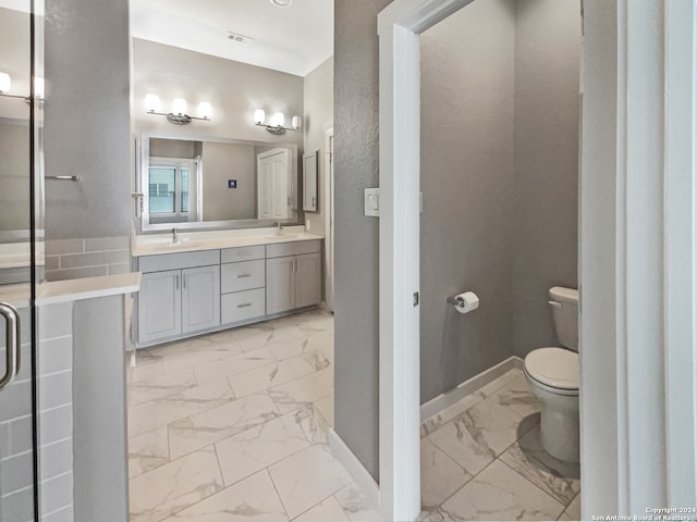 bathroom featuring toilet and vanity