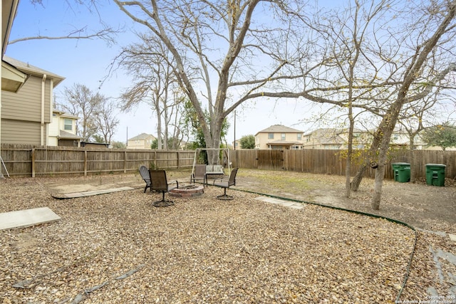 view of yard with a patio and a fire pit