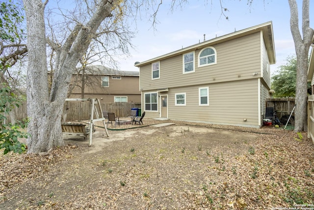 rear view of house with a patio