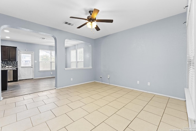 empty room featuring ceiling fan