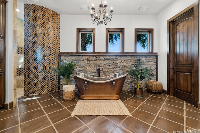 details with tile patterned floors, a notable chandelier, and a washtub