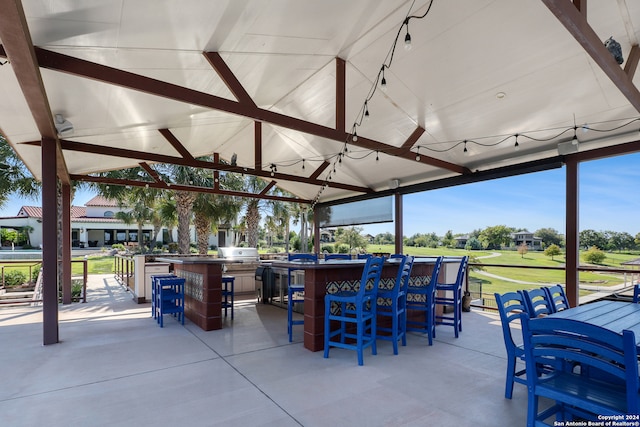 view of patio featuring an outdoor bar