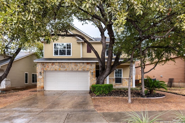10707 Axis Xing, San Antonio, TX 78245 - view of front of property with an attached garage, stone siding, and concrete driveway