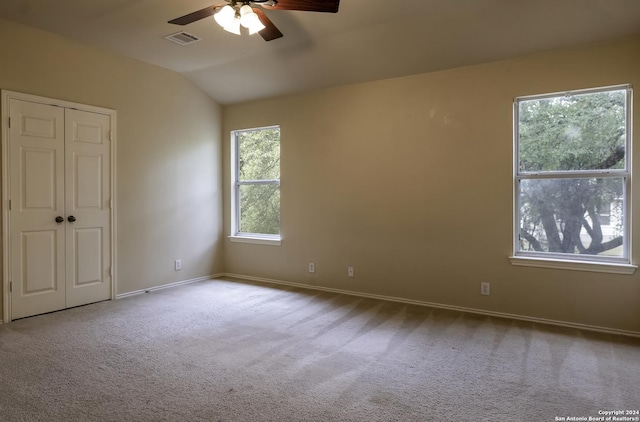 10707 Axis Xing, San Antonio, TX 78245 - carpeted spare room with a ceiling fan, baseboards, and vaulted ceiling