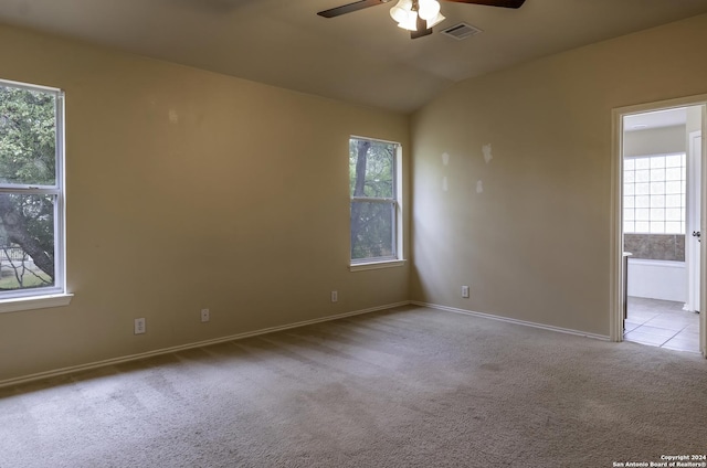 10707 Axis Xing, San Antonio, TX 78245 - carpeted empty room with ceiling fan, baseboards, and vaulted ceiling