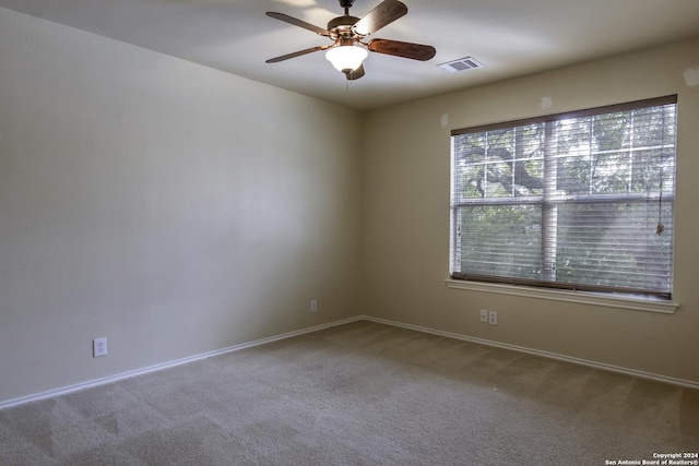 10707 Axis Xing, San Antonio, TX 78245 - unfurnished room featuring carpet, ceiling fan, and baseboards