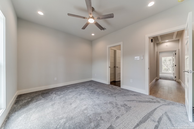 unfurnished bedroom featuring ceiling fan and carpet flooring