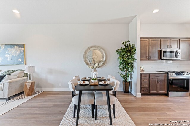 dining space featuring light hardwood / wood-style flooring