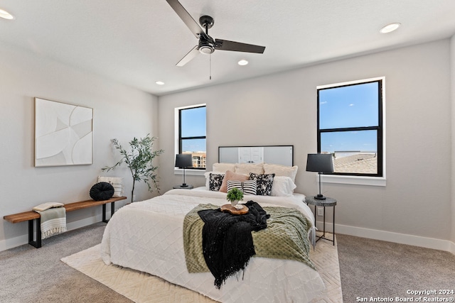 carpeted bedroom with ceiling fan