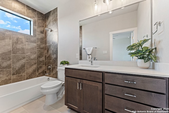 full bathroom with toilet, tiled shower / bath, vanity, and tile patterned flooring