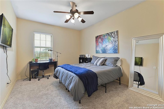 bedroom featuring light carpet and ceiling fan