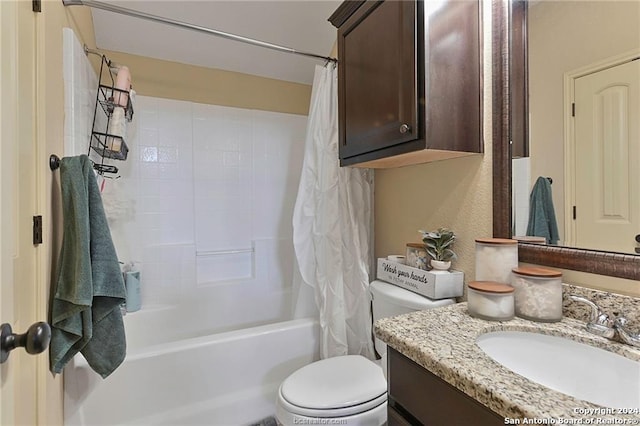 full bathroom with toilet, vanity, and shower / tub combo