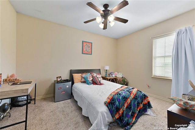 carpeted bedroom with ceiling fan