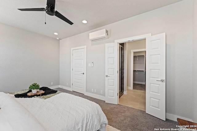 7942 Kennedy Hl Unit 8, San Antonio, TX 78235 - bedroom featuring a wall unit AC, carpet floors, baseboards, ceiling fan, and recessed lighting