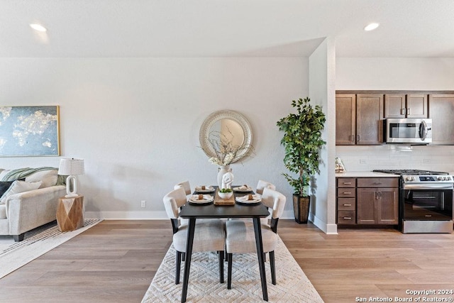 7942 Kennedy Hl Unit 8, San Antonio, TX 78235 - dining space with baseboards, light wood-type flooring, and recessed lighting