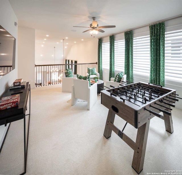 game room featuring ceiling fan and light carpet