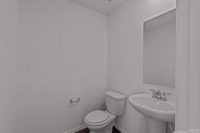 bathroom with toilet and sink