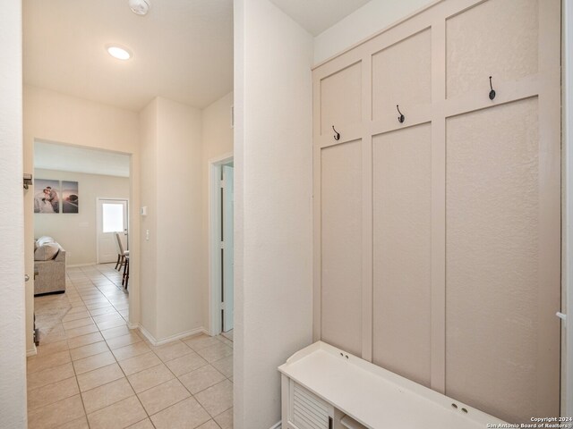 mudroom featuring light tile patterned flooring