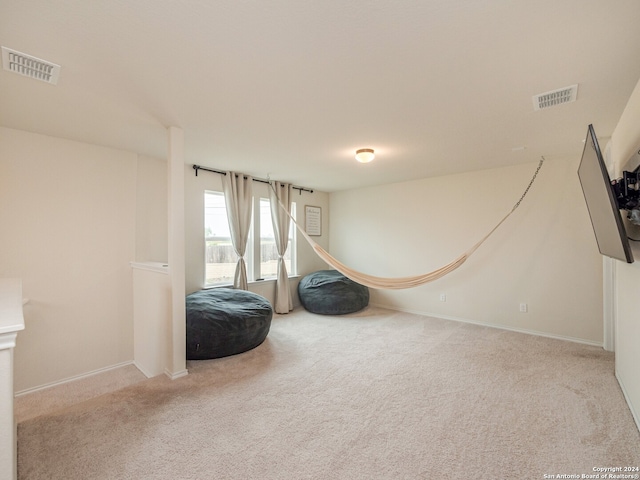 living area featuring light colored carpet