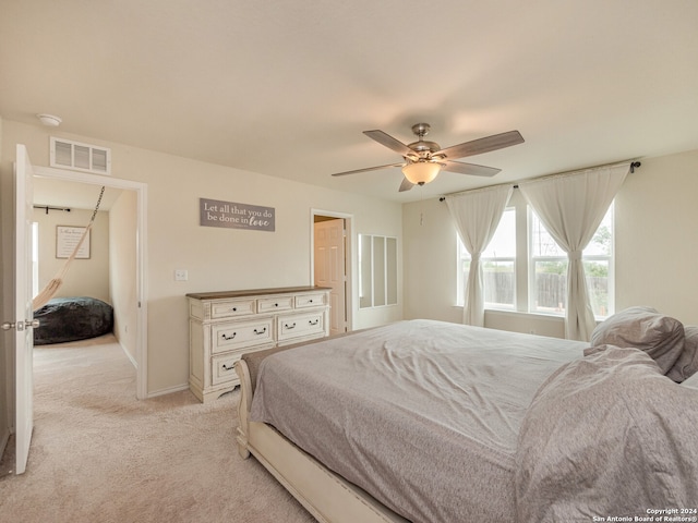 carpeted bedroom with ceiling fan