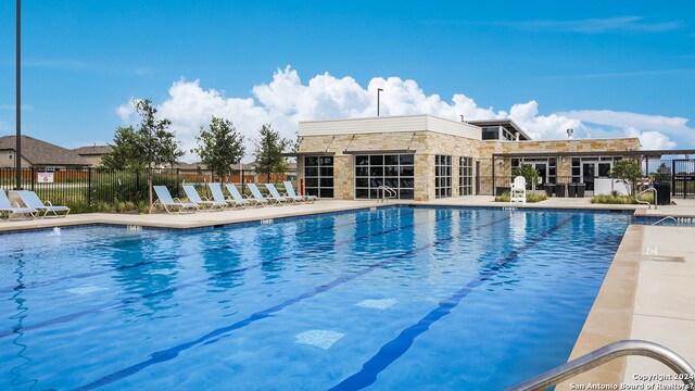 view of swimming pool featuring a patio area