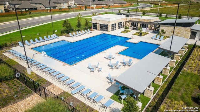 view of swimming pool with a patio area