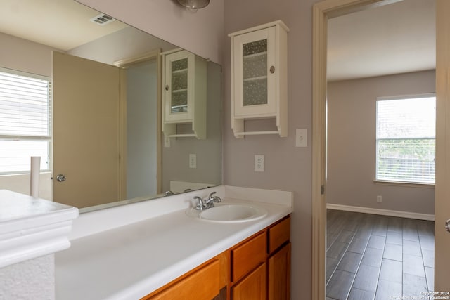 bathroom featuring vanity and wood-type flooring