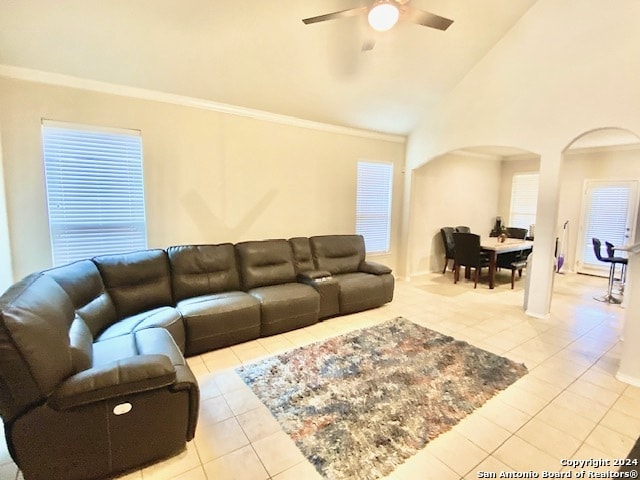 tiled living room featuring vaulted ceiling and ceiling fan