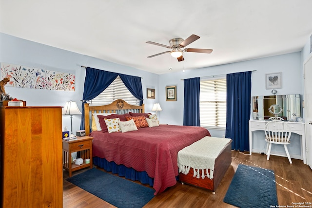 bedroom with dark wood-type flooring and ceiling fan