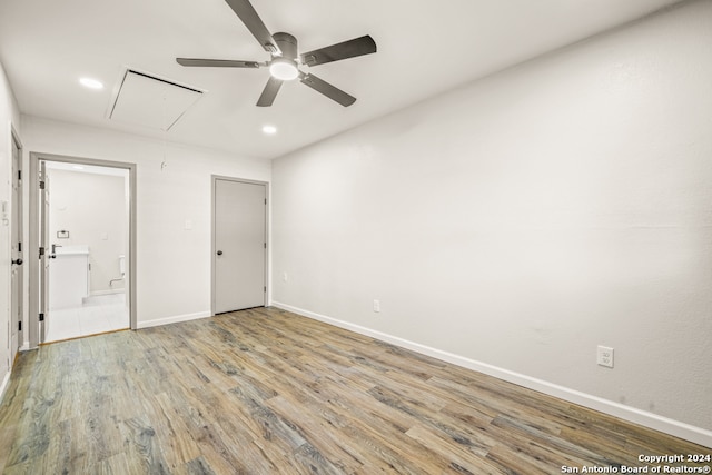 spare room featuring ceiling fan and light hardwood / wood-style flooring