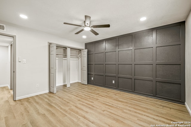 unfurnished bedroom featuring ceiling fan and light wood-type flooring