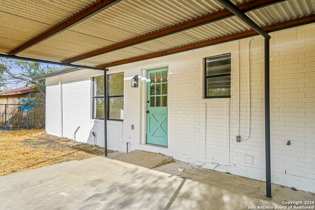 entrance to property with a patio