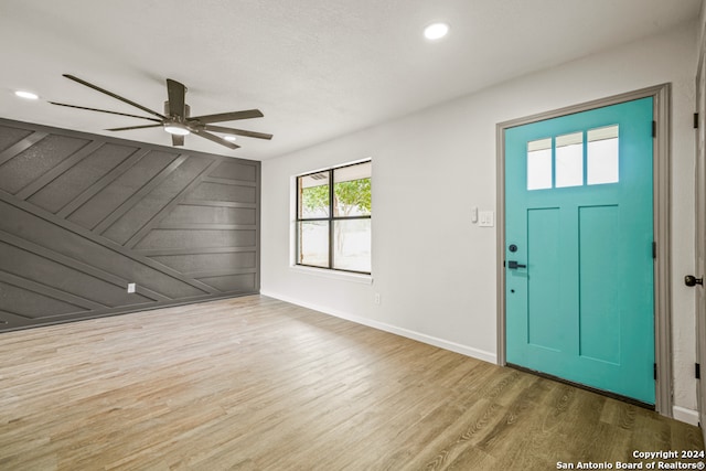 entryway with ceiling fan and hardwood / wood-style floors