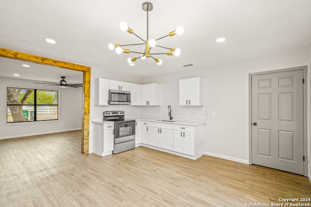 kitchen with decorative backsplash, appliances with stainless steel finishes, sink, light hardwood / wood-style flooring, and white cabinetry