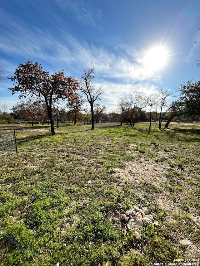 view of yard with a rural view