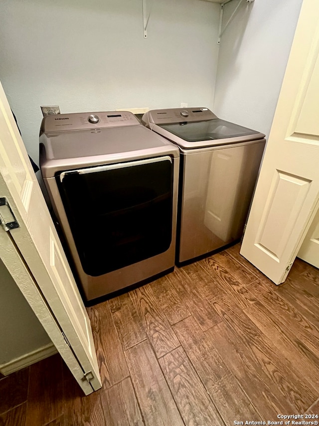 laundry area featuring washer and dryer and light wood-type flooring