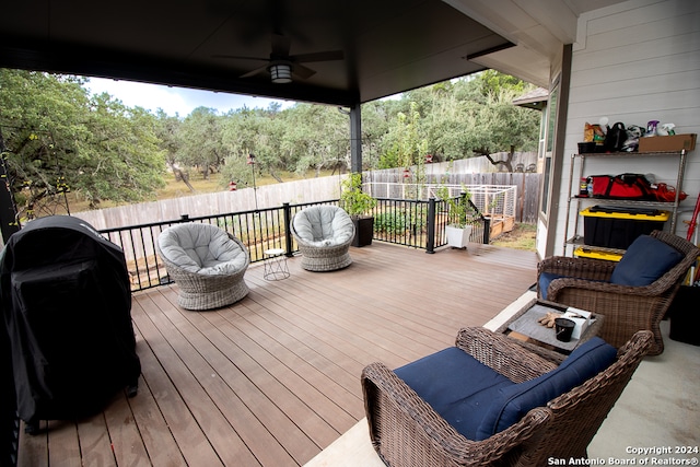 wooden deck featuring ceiling fan