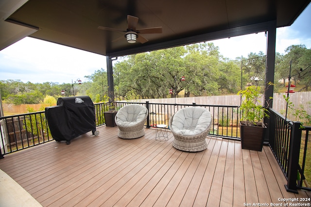 deck with area for grilling and ceiling fan