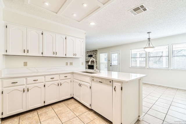 kitchen with sink, decorative light fixtures, white cabinetry, dishwasher, and kitchen peninsula